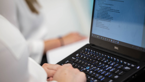 Dynatrace employee working on laptop